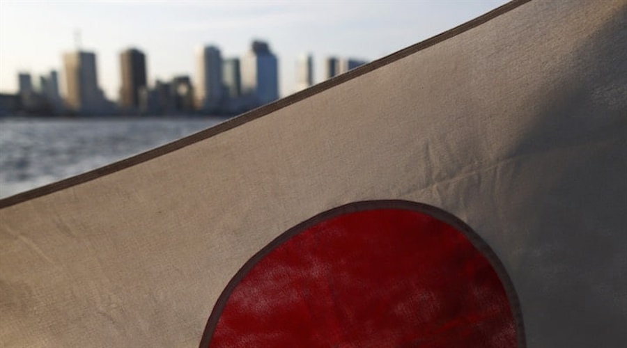 Japan flag against the skyline of Tokyo